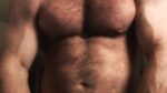 Hairy daddy flexes his muscles and teases