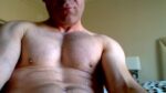 Gay daddy smearing cum on his face